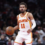 Nov 22, 2024; Chicago, Illinois, USA; Atlanta Hawks guard Trae Young (11) brings the ball up court against the Chicago Bulls during the second half at United Center.