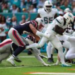 Nov 24, 2024; Miami Gardens, Florida, USA; Miami Dolphins running back De'Von Achane (28) runs for a touchdown during the first half against the New England Patriots at Hard Rock Stadium. Mandatory Credit: Jasen Vinlove-Imagn Images