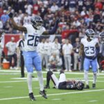 Nov 24, 2024; Houston, Texas, USA; Tennessee Titans cornerback Justin Hardee Sr. (26) reacts after Houston Texans place kicker Ka'imi Fairbairn (15) misses a field goal during the fourth quarter at NRG Stadium. Mandatory Credit: Troy Taormina-Imagn Images