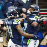 Nov 24, 2024; Seattle, Washington, USA; Seattle Seahawks quarterback Geno Smith (7) celebrates with wide receiver Jaxon Smith-Njigba (11) after a touchdown pass against the Arizona Cardinals during the second quarter at Lumen Field. Mandatory Credit: Joe Nicholson-Imagn Images - Draft