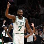 Nov 24, 2024; Boston, Massachusetts, USA; Boston Celtics guard Jaylen Brown (7) reacts to his three point basket against the Minnesota Timberwolves during the second half at TD Garden. Mandatory Credit: Eric Canha-Imagn Images