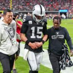Nov 24, 2024; Paradise, Nevada, USA; Las Vegas Raiders quarterback Gardner Minshew (15) heads for the locker room after sustaining an apparent injury during a play against the Denver Broncos during the fourth quarter at Allegiant Stadium.
