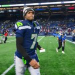 Nov 24, 2024; Seattle, Washington, USA; Seattle Seahawks quarterback Geno Smith (7) walks off the field after the game against the Arizona Cardinals at Lumen Field.
