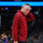 Nov 25, 2024; Denver, Colorado, USA; Denver Nuggets head coach Michael Malone reacts after a calling a timeout in the fourth quarter against the New York Knicks at Ball Arena.