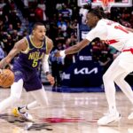 Nov 27, 2024; New Orleans, Louisiana, USA; New Orleans Pelicans guard Dejounte Murray (5) dribbles against Toronto Raptors guard Ja'Kobe Walter (14) during the first half at Smoothie King Center. Mandatory Credit: Stephen Lew-Imagn Images