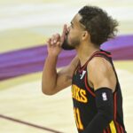 Nov 27, 2024; Cleveland, Ohio, USA; Atlanta Hawks guard Trae Young (11) reacts after making a three-point basket in the fourth quarter against the Cleveland Cavaliers at Rocket Mortgage FieldHouse. Mandatory Credit: David Richard-Imagn Images