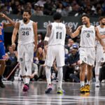 Nov 27, 2024; Dallas, Texas, USA; Dallas Mavericks guard Spencer Dinwiddie (26) and guard Kyrie Irving (11) and guard Quentin Grimes (5) celebrate during the second half against the New York Knicks at the American Airlines Center.