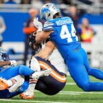 Detroit Lions linebacker Malcolm Rodriguez (44) tackles Chicago Bears tight end Cole Kmet (85) during the first half at Ford Field in Detroit on Thursday, Nov. 28, 2024.