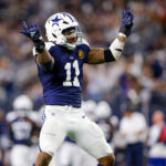 Nov 28, 2024; Arlington, Texas, USA; Dallas Cowboys linebacker Micah Parsons (11) celebrates after a sack during the third quarter against the New York Giants at AT&T Stadium. Mandatory Credit: Andrew Dieb-Imagn Images