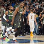 Nov 1, 2024; Minneapolis, Minnesota, USA; Minnesota Timberwolves guard Anthony Edwards (5) celebrates after scoring to put the Minnesota Timberwolves up with 16 seconds left in the game against the Denver Nuggets in the fourth quarter at Target Center.