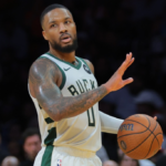Nov 26, 2024; Miami, Florida, USA; Milwaukee Bucks guard Damian Lillard (0) reacts against the Miami Heat during the third quarter at Kaseya Center.