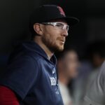 Boston Red Sox catcher Danny Jansen (28) talks to a teammate in the dugout during the seventh inning against the Toronto Blue Jays at Rogers Centre.