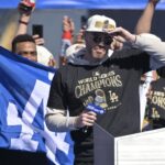 Los Angeles Dodgers first base Freddie Freeman (5) speaks to fans during the World Series Championship Celebration at Dodger Stadium.