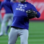 Los Angeles Dodgers third baseman Max Muncy (13) works out a day before game three of the World Series against the New York Yankees at Yankees Stadium.