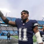 Dallas Cowboys linebacker Micah Parsons (11) walks off the field after the game at Bank of America Stadium.