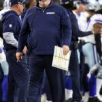 Dallas Cowboys head coach Mike McCarthy walks on the sidelines during the game against the Tampa Bay Buccaneers at AT&T Stadium.