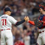 Minnesota Twins relief pitcher Jovani Moran (71) celebrates with Minnesota Twins catcher Ryan Jeffers (27) after defeating the Chicago White Sox at Target Field.