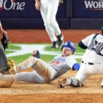 Los Angeles Dodgers second baseman Gavin Lux (9) scores a run ahead of the tag of New York Yankees catcher Jose Trevino (39) during the sixth inning in game three of the 2024 MLB World Series at Yankee Stadium.