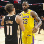 Dec 15, 2019; Atlanta, GA, USA; NBA; Los Angeles Lakers forward LeBron James (23) talks to Atlanta Hawks guard Trae Young (11) after a game at State Farm Arena.