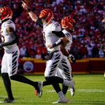 Cincinnati Bengals quarterback Joe Burrow (9) gestures as he takes the field for an offensive possession with Cincinnati Bengals wide receiver Tee Higgins (85) and Cincinnati Bengals wide receiver Ja'Marr Chase (1) in the first quarter during the AFC championship NFL football game against the Kansas City Chiefs, Sunday, Jan. 30, 2022, at GEHA Field at Arrowhead Stadium in Kansas City, Mo. Cincinnati Bengals At Kansas City Chiefs Jan 30 Afc Championship 358