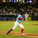 Hooks’ Emmanuel Valdez (2) rounds first base for a double in the Corpus Christi Hooks season opener against the San Antonio Missions on April 8, 2022 in Corpus Christi, Texas.