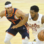 Apr 26, 2023; Cleveland, Ohio, USA; New York Knicks guard Josh Hart (3) defends Cleveland Cavaliers guard Donovan Mitchell (45) in the fourth quarter during game five of the 2023 NBA playoffs at Rocket Mortgage FieldHouse.