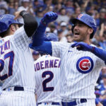 Jul 15, 2023; Chicago, Illinois, USA; Chicago Cubs center fielder Cody Bellinger (24) is greeted by right fielder Seiya Suzuki (27) after hitting a grand slam home run against the Boston Red Sox during the third inning at Wrigley Field. Mandatory Credit: David Banks-USA TODAY Sports