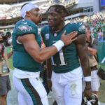 AJ Brown Jalen Hurts Oct 1, 2023; Philadelphia, Pennsylvania, USA; Philadelphia Eagles quarterback Jalen Hurts (1) and wide receiver A.J. Brown (11) walk off the field against the Washington Commanders at Lincoln Financial Field.