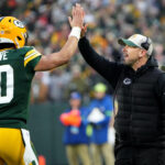 Jan 7, 2024; Green Bay, Wisconsin, USA; Green Bay Packers quarterback Jordan Love (10) high fives head coach Matt LaFleur after throwing a touchdown pass during the second quarter of their game against the Chicago Bear at Lambeau Field. Mandatory Credit: Mark Hoffman-USA TODAY Sports