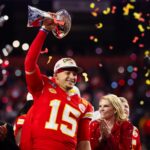 Feb 11, 2024; Paradise, Nevada, USA; Kansas City Chiefs quarterback Patrick Mahomes (15) celebrates with the Vince Lombardi Trophy after defeating the San Francisco 49ers in overtime of Super Bowl LVIII at Allegiant Stadium.