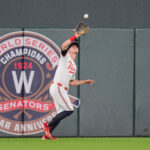 Aug 27, 2024; Minneapolis, Minnesota, USA; Minnesota Twins outfielder Max Kepler (26) fields a fly ball against the Atlanta Braves in the eighth inning at Target Field. Mandatory Credit: Brad Rempel-USA TODAY Sports