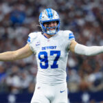 Oct 13, 2024; Arlington, Texas, USA; Detroit Lions defensive end Aidan Hutchinson (97) reacts during the second quarter against the Dallas Cowboys at AT&T Stadium. Mandatory Credit: Kevin Jairaj-Imagn Images