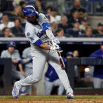 Oct 30, 2024; New York, New York, USA; Los Angeles Dodgers outfielder Teoscar Hernandez (37) singles during the ninth inning against the New York Yankees in game five of the 2024 MLB World Series at Yankee Stadium. Mandatory Credit: Vincent Carchietta-Imagn Images