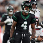 Oct 31, 2024; East Rutherford, New Jersey, USA; New York Jets cornerback D.J. Reed (4) reacts after sacking Houston Texans quarterback C.J. Stroud (7) during the first quarter at MetLife Stadium.
