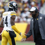 Nov 10, 2024; Landover, Maryland, USA; Pittsburgh Steelers head coach Mike Tomlin (R) congratulates Steelers wide receiver George Pickens (14) after a long catch against the Washington Commanders during the second half at Northwest Stadium. Mandatory Credit: Geoff Burke-Imagn Images
