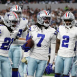 Nov 10, 2024; Arlington, Texas, USA; Dallas Cowboys cornerback Trevon Diggs (7) and his teammates react after an interception in the second quarter against the Philadelphia Eagles at AT&T Stadium. Mandatory Credit: Tim Heitman-Imagn Images
