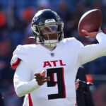 Nov 17, 2024; Denver, Colorado, USA; Atlanta Falcons quarterback Michael Penix Jr. (9) warms up before the game against the Denver Broncos at Empower Field at Mile High. Mandatory Credit: Ron Chenoy-Imagn Images