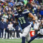 Nov 24, 2024; Seattle, Washington, USA; Seattle Seahawks wide receiver Jaxon Smith-Njigba (11) runs for yards after the catch against the Arizona Cardinals during the second quarter at Lumen Field. Mandatory Credit: Joe Nicholson-Imagn Images