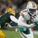 Nov 28, 2024; Green Bay, Wisconsin, USA; Miami Dolphins wide receiver Jaylen Waddle (17) rushes with the football after catching a pass during the second quarter against the Green Bay Packers at Lambeau Field. Mandatory Credit: Jeff Hanisch-Imagn Images