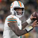 Nov 28, 2024; Green Bay, Wisconsin, USA; Miami Dolphins quarterback Tua Tagovailoa (1) throws a pass during the fourth quarter against the Green Bay Packers at Lambeau Field. Mandatory Credit: Jeff Hanisch-Imagn Images