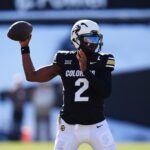 Nov 29, 2024; Boulder, Colorado, USA; Colorado Buffaloes quarterback Shedeur Sanders (2) prepares to pass the ball in the third quarter against the Oklahoma State Cowboys at Folsom Field. Mandatory Credit: Ron Chenoy-Imagn Images