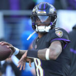 Dec 1, 2024; Baltimore, Maryland, USA; Baltimore Ravens quarterback Lamar Jackson (8) warms up prior the game against the Philadelphia Eagles at M&T Bank Stadium.