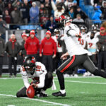 Dec 1, 2024; Charlotte, North Carolina, USA; Tampa Bay Buccaneers place kicker Chase McLaughlin (4) kicks the game winning field goal in overtime at Bank of America Stadium. Mandatory Credit: Bob Donnan-Imagn Images