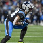 Dec 1, 2024; Charlotte, North Carolina, USA; Carolina Panthers running back Jonathon Brooks (24) runs for yardage against the Tampa Bay Buccaneers during the second half at Bank of America Stadium. Mandatory Credit: Jim Dedmon-Imagn Images