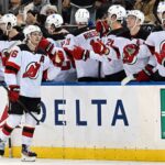 Dec 2, 2024; New York, New York, USA; New Jersey Devils center Jack Hughes (86) celebrates his goal against the New York Rangers with teammates during the second period at Madison Square Garden. Mandatory Credit: Dennis Schneidler-Imagn Images