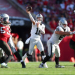 Dec 8, 2024; Tampa, Florida, USA; Las Vegas Raiders quarterback Desmond Ridder (10) throws a pass against the Tampa Bay Buccaneers in the fourth quarter at Raymond James Stadium. Mandatory Credit: Nathan Ray Seebeck-Imagn Images - Draft