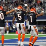 Cincinnati Bengals wide receiver Andrei Iosivas (80), wide receiver Tee Higgins (5) and wide receiver Ja'Marr Chase (1) dance after Chase’s touchdown in the 4th quarter that gave them the victory over Dallas Cowboys during Monday Night Football at AT&T Stadium in Arlington,Texas on Monday, December 9, 2024. The Bengals won 27-20.
