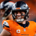 Dec 15, 2024; Denver, Colorado, USA; Denver Broncos quarterback Bo Nix (10) in the fourth quarter against the Indianapolis Colts at Empower Field at Mile High. Mandatory Credit: Isaiah J. Downing-Imagn Images