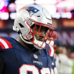 Dec 15, 2024; Glendale, Arizona, USA; New England Patriots defensive tackle Christian Barmore (90) against the Arizona Cardinals at State Farm Stadium. Mandatory Credit: Mark J. Rebilas-Imagn Images