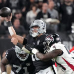 Dec 16, 2024; Paradise, Nevada, USA; Las Vegas Raiders quarterback Desmond Ridder (10) throws the ball against Atlanta Falcons linebacker DeAngelo Malone (51) in the second half at Allegiant Stadium. Mandatory Credit: Kirby Lee-Imagn Images - Draft